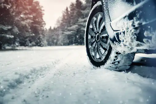 Car tires on winter road